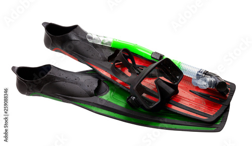 Mask, snorkel and flippers of different colors with water drops