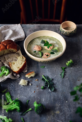 Broccoli cream soup with salmon dumplings.selective focus