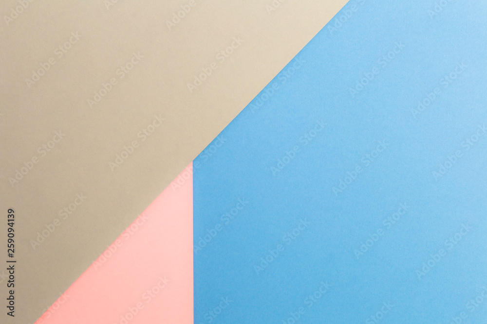Multicolor background from cardboard of different colors. Pastel paper color for background. Colorful abstract geometric shapes. Pastel colored paper texture minimalism background. Pink, Blue, Grey.
