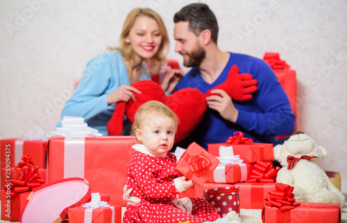 Valentines day. I give you my heart. Love and trust in family. Bearded man and woman with little girl. father, mother and doughter child. Shopping online. Boxing day. Happy family with present box