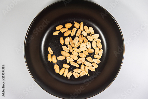 Nuts in black ceramic plate.