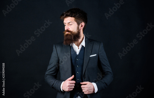 Impeccable style. Man bearded guy wear suit outfit. Perfect elegant tuxedo outfit. Elegancy and male style. Fashion concept. Guy wear formal outfit. Businessman fashionable outfit black background