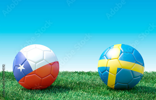 Two soccer balls in flags colors on green grass. Chile and Sweden. 3d image