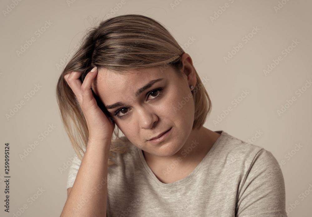 Portrait of sad depressed woman having headache and emotional pain. In Health and Human expressions Portrait of sad depressed woman having headache and emotional pain. In Health and Human expressions