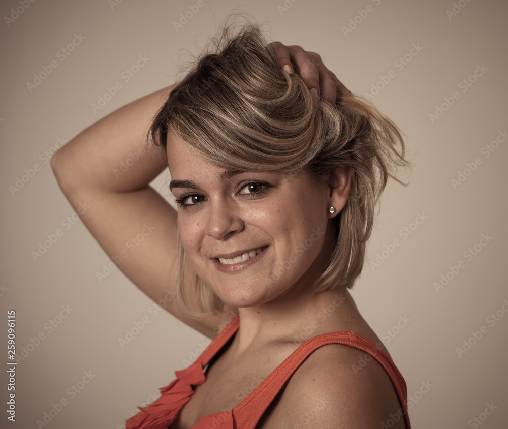 Portrait of an attractive woman with happy and smiling face. In beauty, model and fashion concept Portrait of an attractive woman with happy and smiling face. In beauty, model and fashion concept