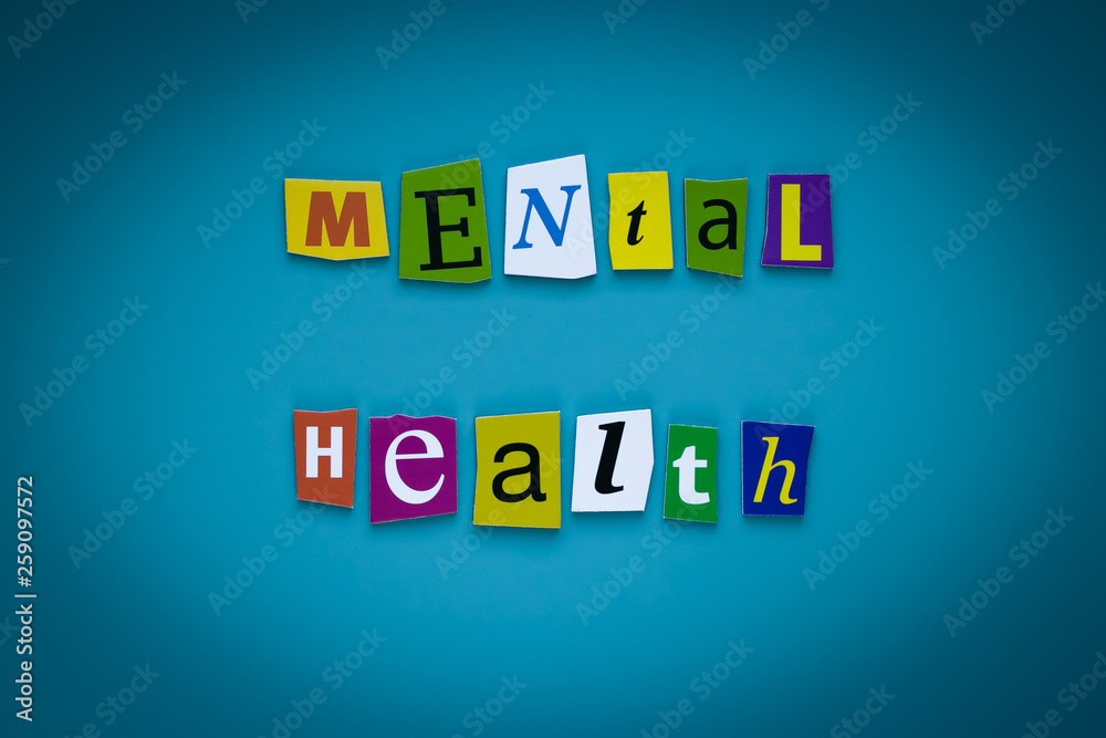 Obraz premium A word writing text - mental health - of cut letters on a blue background. Headline - mental health. Banner with inscription - mental health. Psychologic concept.