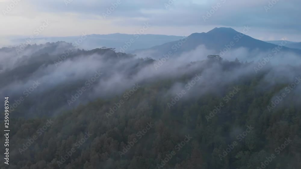 Aerial view of mount Batur and lake Batur in the evening with the evaporation of clouds. Aerial view of mount Batur and lake Batur in the evening with the evaporation of clouds.