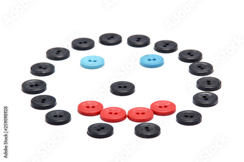 Plastic buttons of different colors. a smile from the buttons