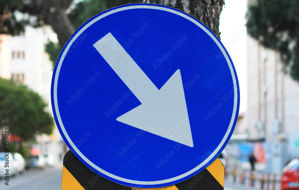 traffic sign with blue circular arrow
