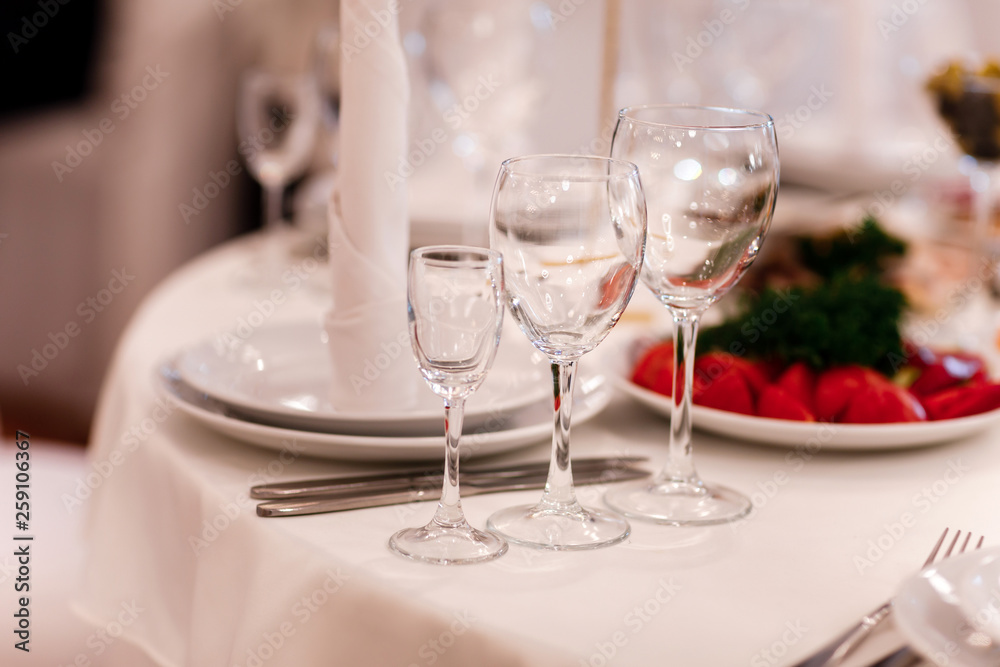 Glass glasses on the table. wine restaurant serving romance beautiful concept alcohol glass, holiday dinner in a cafe