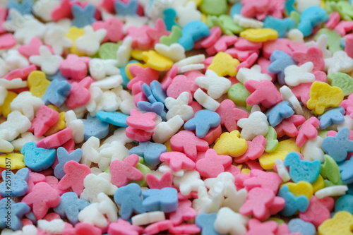 Colorful sugar sprinkles background. Top view with copy space.