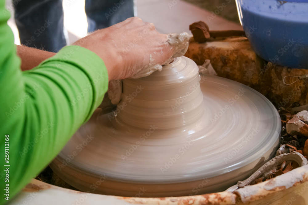 Hands of potter making clay pot Hands of potter making clay pot