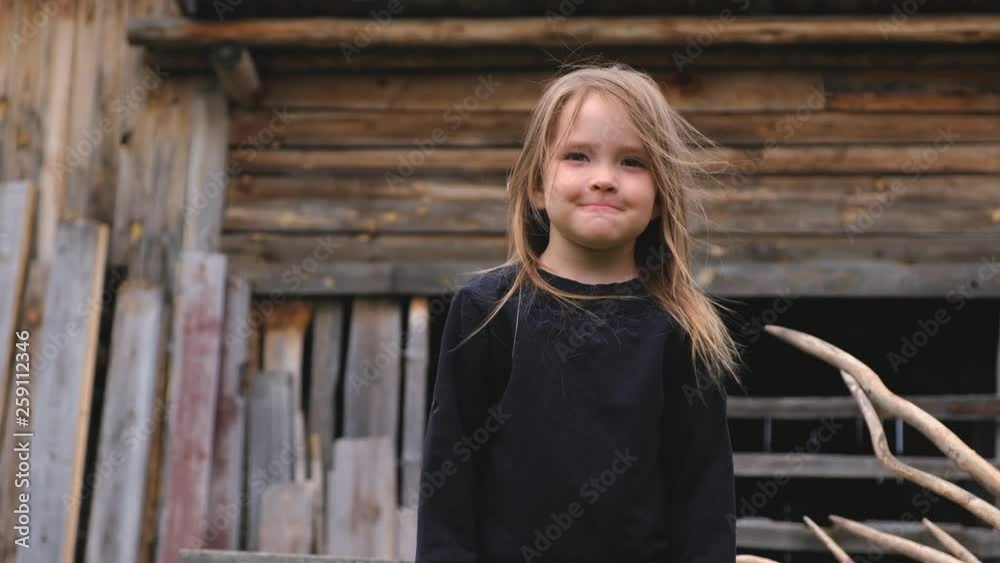 Portrait of a beautiful little girl in a black sweater Portrait of a beautiful little girl in a black sweater