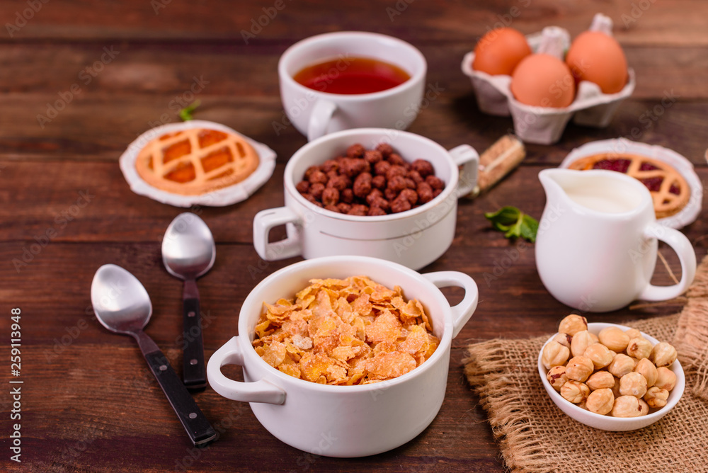 Tasty and useful breakfast with flakes, milk, nuts and dried fruits. The healthy food loading with energy Tasty and useful breakfast with flakes, milk, nuts and dried fruits. The healthy food loading with energy