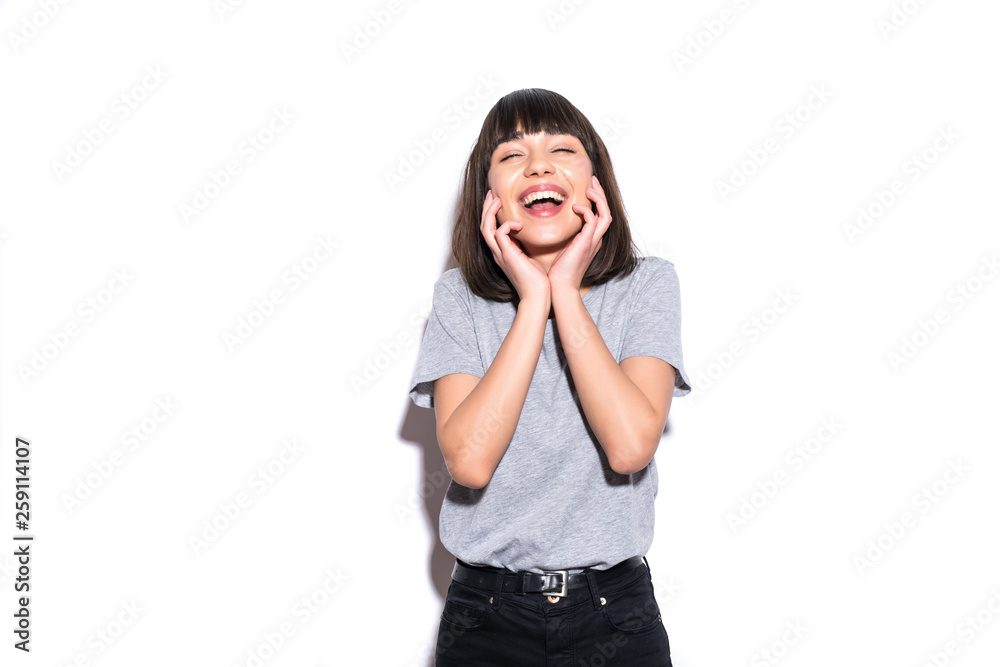 Pretty girl laughting hysterically. Young woman spread her hands in spread her hands at a loss. Pretty girl laughting hysterically. Young woman spread her hands in spread her hands at a loss.