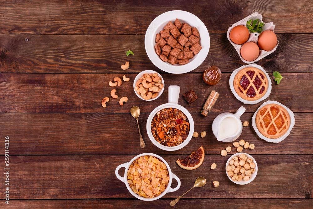 Tasty and useful breakfast with flakes, milk, nuts and dried fruits. The healthy food loading with energy Tasty and useful breakfast with flakes, milk, nuts and dried fruits. The healthy food loading with energy