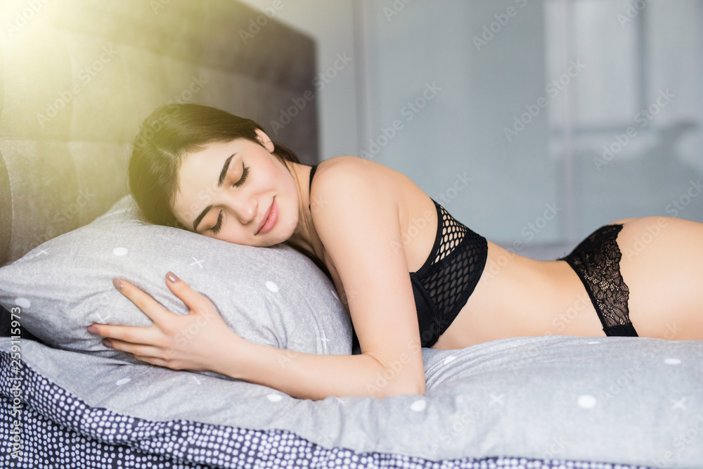 girl sleeping in lingerie in bed woke up, Stock Video