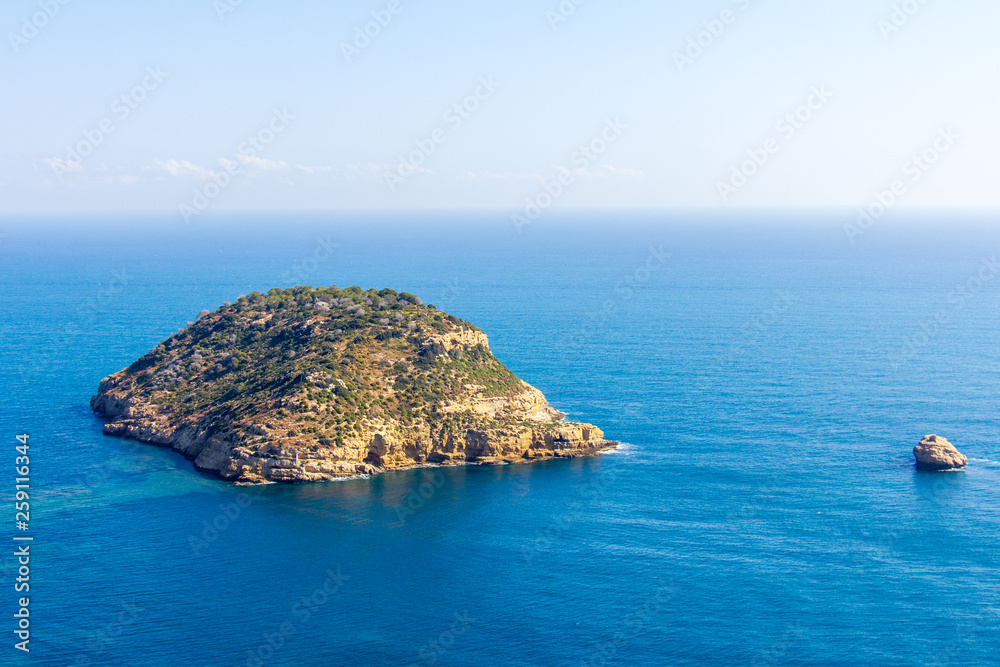 Fototapeta premium Aerial view of Portitxol Island in Javea, Spain