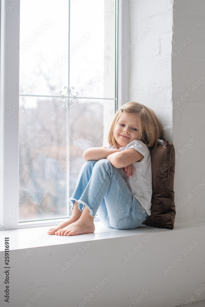 Full length of beautiful little girl in dress standing and posing over white background Full length of beautiful little girl in dress standing and posing over white background