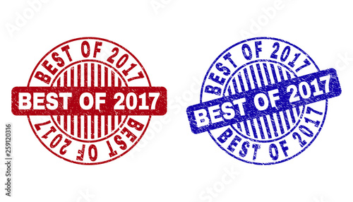 Grunge BEST OF 2017 round stamp seals isolated on a white background. Round seals with grunge texture in red and blue colors.