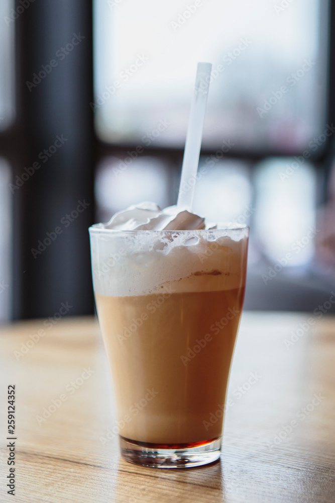 the process of preparing a delicious coffee drink with whipped cream that is decorated with coffee with milk the process of preparing a delicious coffee drink with whipped cream that is decorated with coffee with milk
