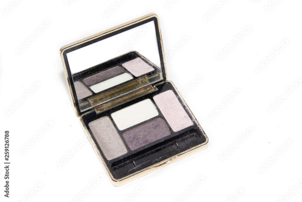 Nail polishes and eye shadow isolated on white background. Nail polishes isolated on white background. Cosmetics on white background Nail polishes and eye shadow isolated on white background. Nail polishes isolated on white background. Cosmetics on white background