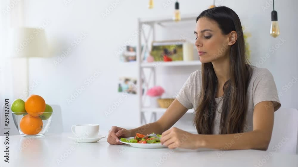 Happy woman eating salad, healthy vegetarian diet for weight loss, nutrition Happy woman eating salad, healthy vegetarian diet for weight loss, nutrition
