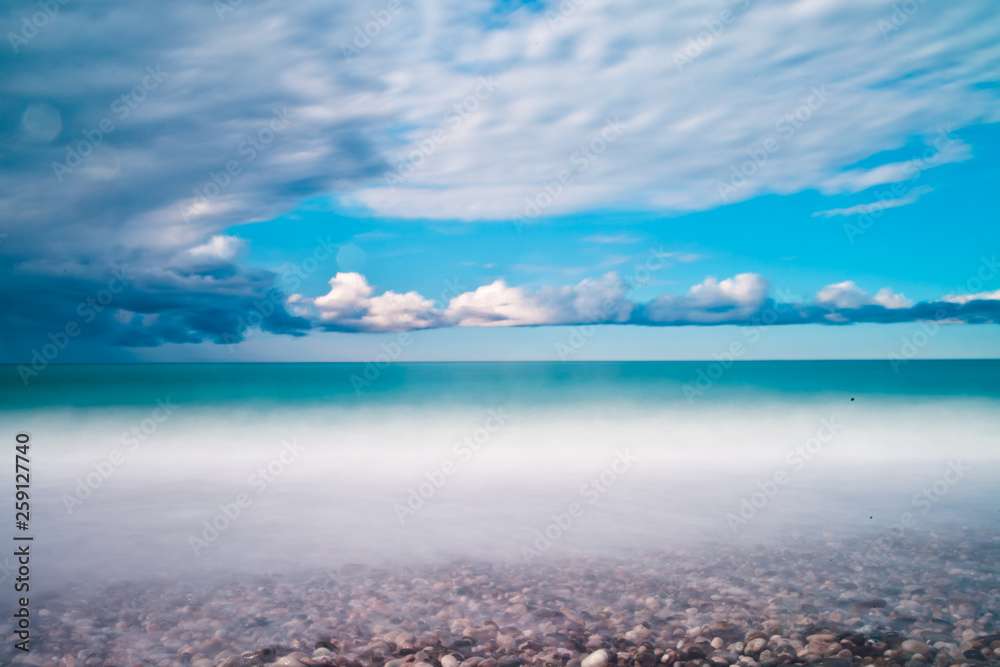 Fototapeta premium Very blue beautiful calm sea, rich colors and sky, a resort holiday in in Abkhazia