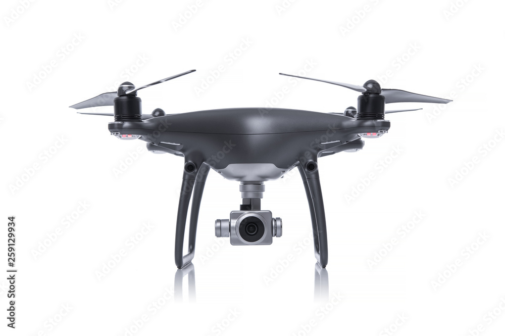 Black drone with camera isolated on white background. Quadcopter for flying and shooting 4K UHD video and photos. Black drone with camera isolated on white background. Quadcopter for flying and shooting 4K UHD video and photos.