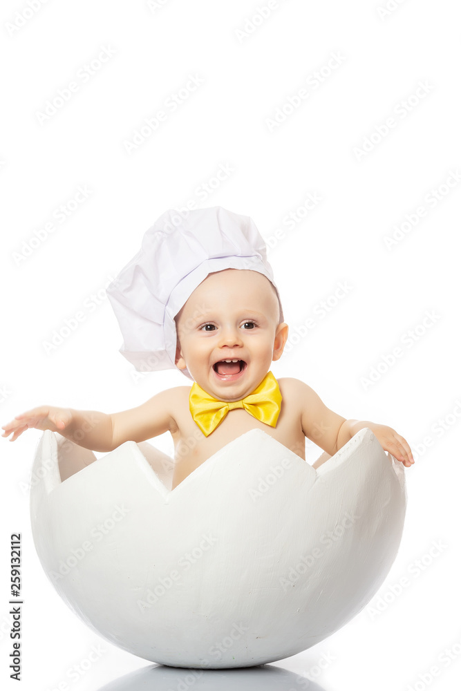 Food banner for text or design. Little Chef. Adorable baby boy dressed in s chef's hat sitting in egg shell baby with a yellow butterfly on white background Food banner for text or design. Little Chef. Adorable baby boy dressed in s chef's hat sitting in egg shell baby with a yellow butterfly on white background