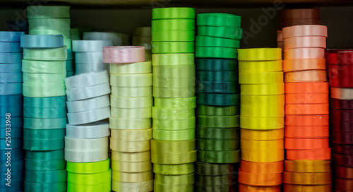 close up of stack of colorful ribbon on shelves