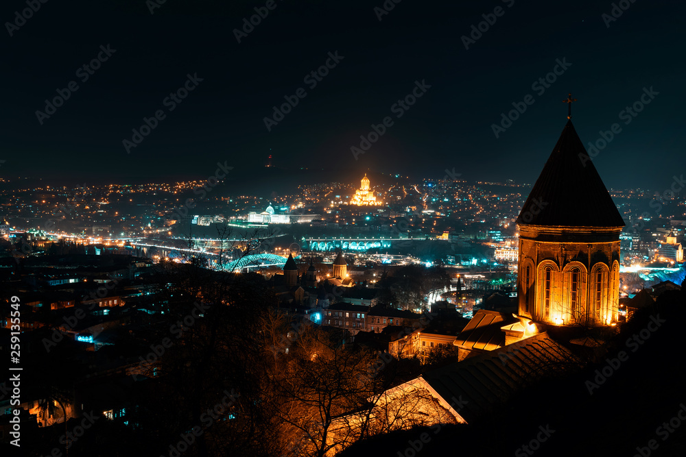 Georgia, Tbilisi - 05.02.2019. - Night panorama aerial view over Georgian capital main landmarks - Night image