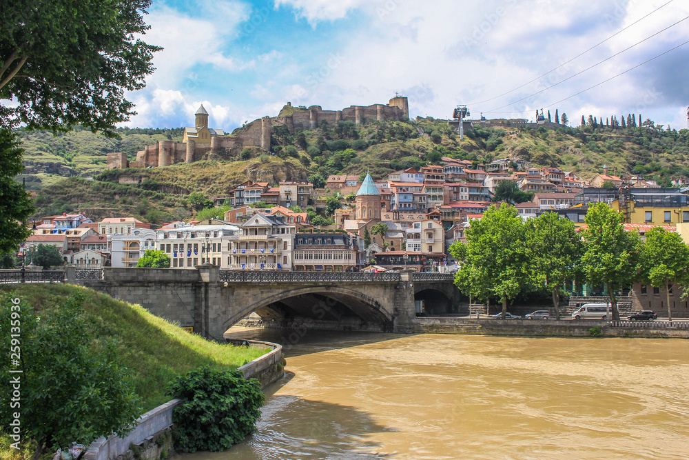 Fototapeta premium Walking in Tbilisi. Bridges over the Kura river in the Georgian capital