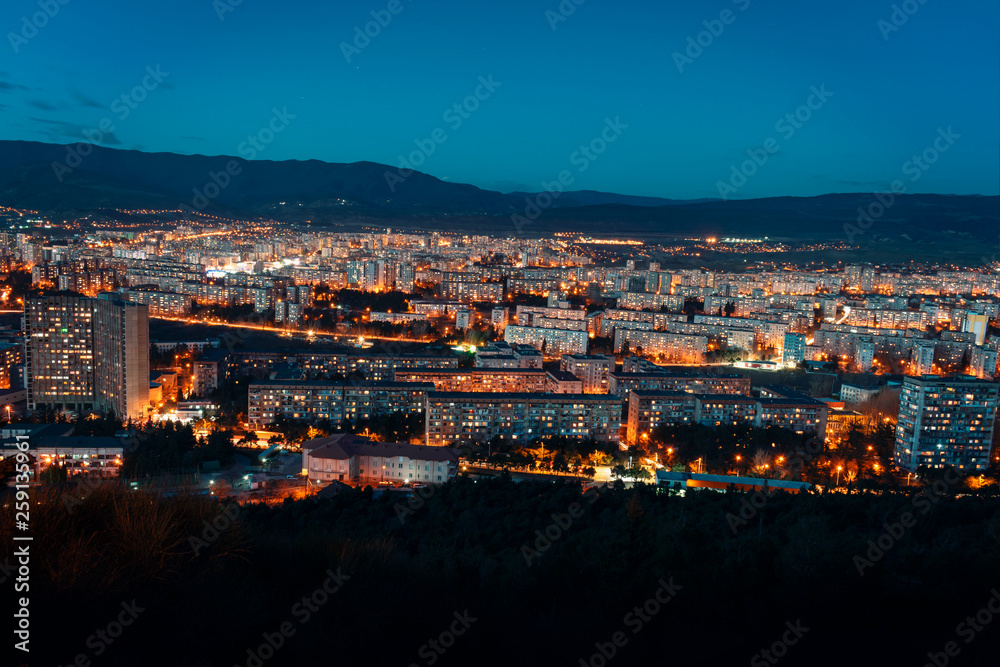 aerial view, night cityscape view with night sky. natural clear view over big city blocks with street lights and hills around - Image