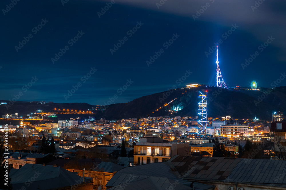 Georgia, Tbilisi - 05.02.2019. - Night cityscape view. Beautiful tv tower and famous landmarks illuminated - Image