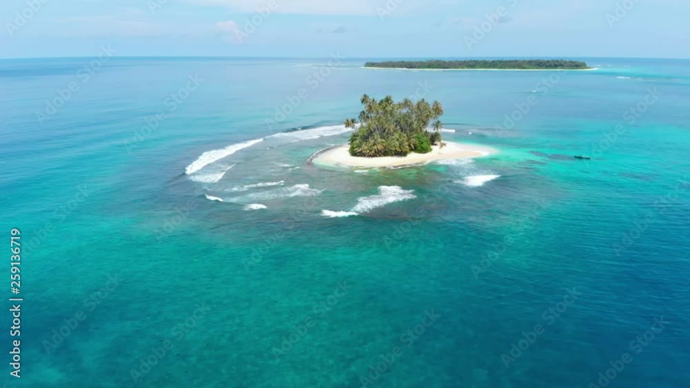 Aerial: flying over desert island tropical beach caribbean sea coral reef sunset sky. Indonesia Sumatra Banyak islands travel destination