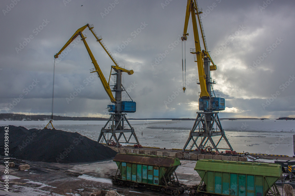 The city's port in Vyborg. Yellow port cranes The city's port in Vyborg. Yellow port cranes