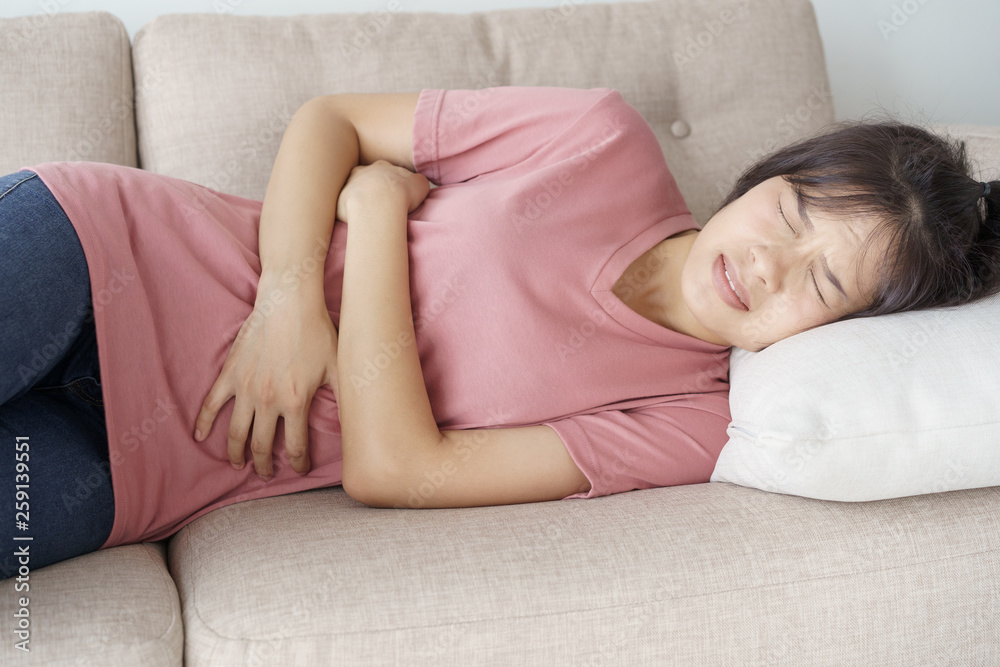 asian woman with menstruation and pain period cramps. young women having painful stomachache. asian woman with menstruation and pain period cramps. young women having painful stomachache.