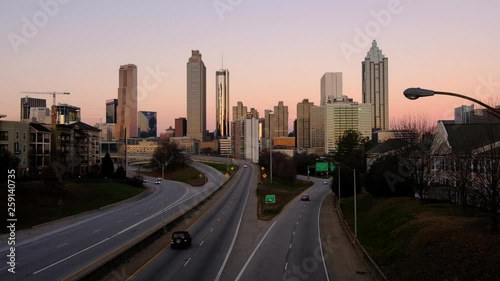 ATLANTA GEORGIA, January 20, 2019:  Light car traffic moving towards the Atlanta Georgia downtown modern skyline at night. USA