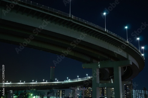 curved highway of tokyo illuminated in night