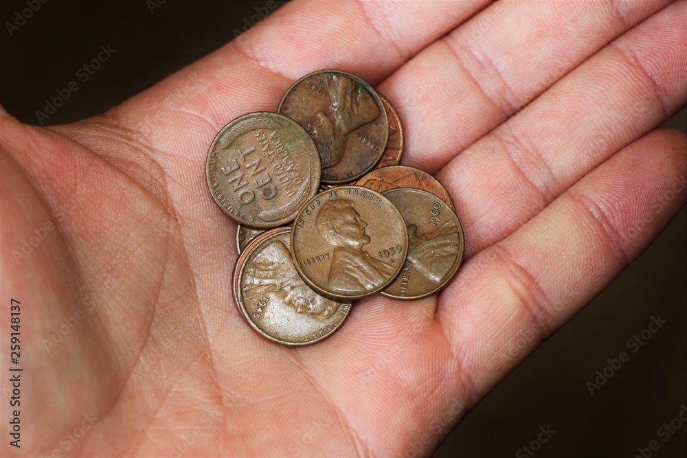 hand with coins isolated. Lincoln cents. Currency of the united states of America. hand with coins isolated. Lincoln cents. Currency of the united states of America.