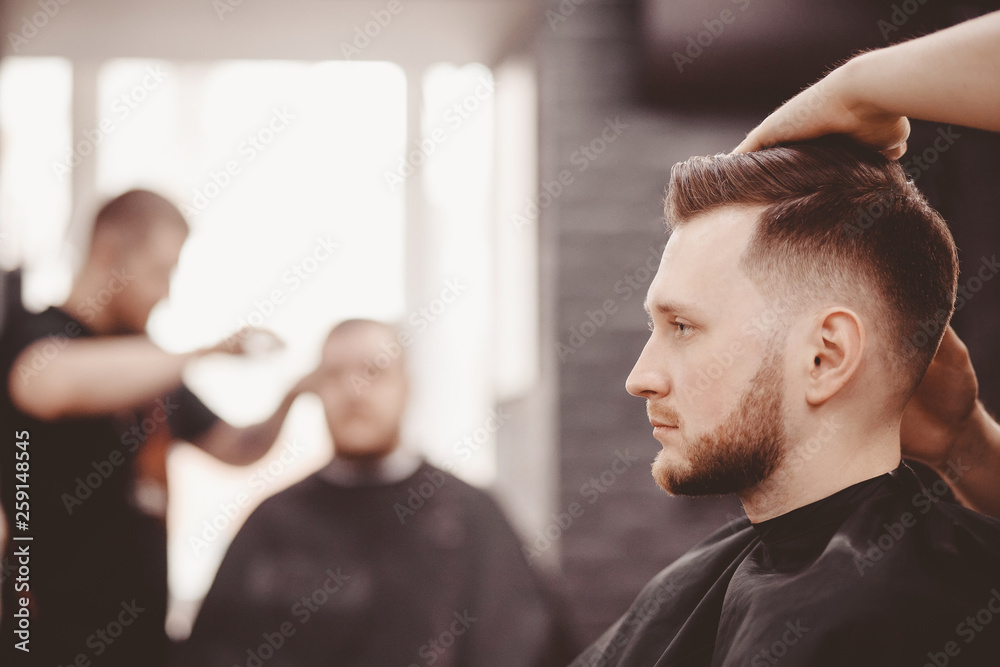 Barbershop banner. Man in barber chair, hairdresser styling his hair. Stock  Photo | Adobe Stock
