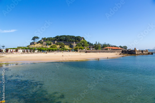 Baiona, Spain. The beach and the fortress of Monterreal (Castillo de Monterreal). The fortress is included in the list of the most picturesque historical buildings of UNESCO