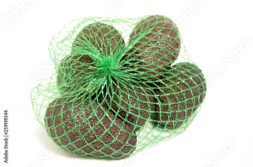 Avocados in a plastic grid.