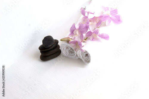 stone spa and orchid on white background