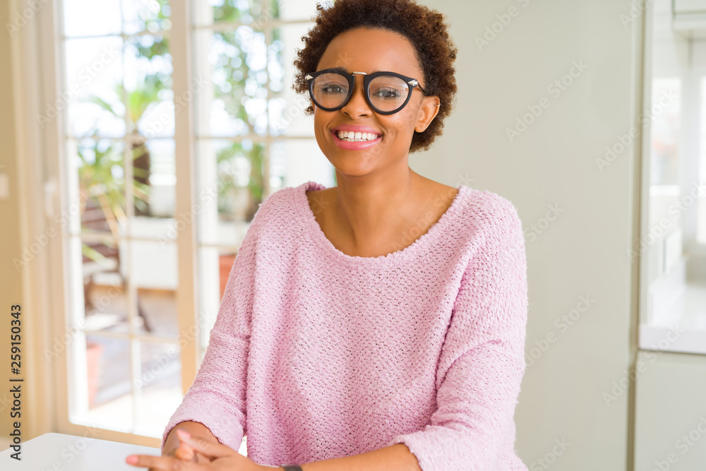 Beautiful young african woman with afro hair wearing glasses Beautiful young african woman with afro hair wearing glasses