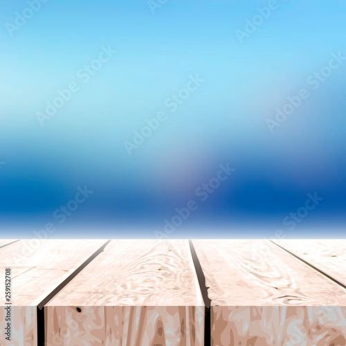 Fall blurred background with wooden table for your design.