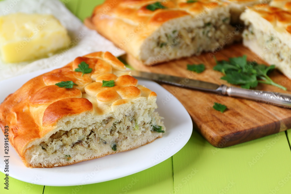 Freshly baked fish pie on a green wooden table. Freshly baked fish pie on a green wooden table.