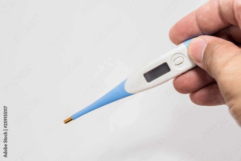Hand holding the thermometer on white screen isolated Hand holding the thermometer on white screen isolated