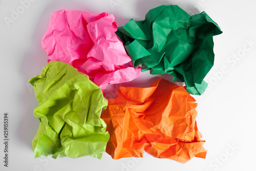 Composition of rumpled paper sheets placed on a white background.